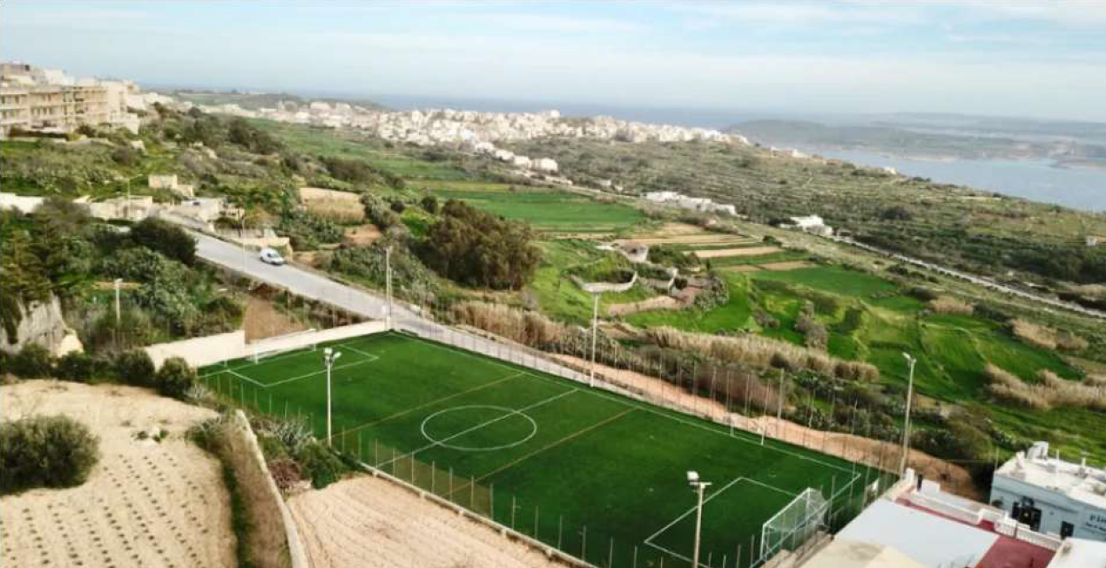Aerial view of the Peter Paul Camilleri Ground and surrounding Nadur countryside
